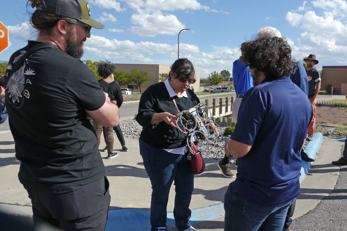 Droning On participant examines a drone